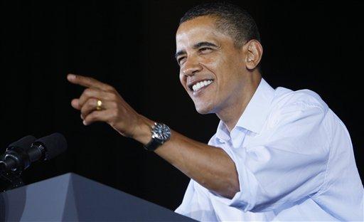 President Barack Obama gestures as he addresses union workers and their families at the AFL-CIO Labor Day picnic at Coney Island in Cincinnati, Monday, Sept. 7, 2009.