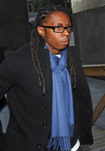 Rapper Lil Wayne enters Manhattan criminal court, Wednesday, Oct. 21, 2009, in New York. A hearing on a DNA profiling technique used in the rapper's 2007 gun-possession case was due to start Wednesday.