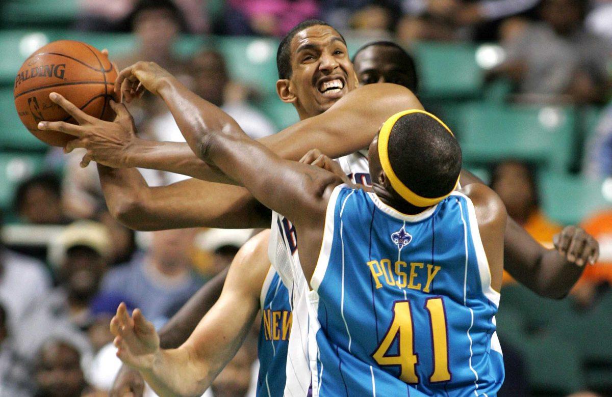 The Bobcats&#8217; Alexis Ajinca, top, looks for a pass around the Hornets&#8217; James Posey during New Orleans&#8217; preseason game against Charlotte on Thursday in Greensboro, NC.