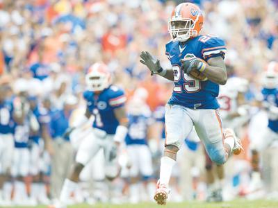 Florida senior running back and return specialist Brandon James returns a punt Sept. 12 during the Gators&#8217; 56-6 win against Troy in Gainesville, Fla.