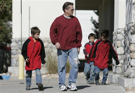 Richard Heene and his three sons Bradford, Ryo and Falcon leave a Halloween costume store in Fort Collins, Colo., Monday Oct. 26, 2009. Charges could be brought against Richard Heene for perpetrating the "balloon boy" hoax.