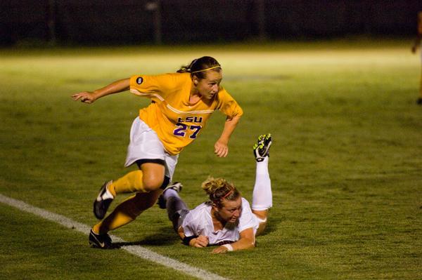 LSU freshman forward Carlie Banks runs around a Georgia player Sept. 25 at the LSU Soccer Complex. The Tigers defeated the Bulldogs, 6-0, with the help of Banks&#8217; hat trick.