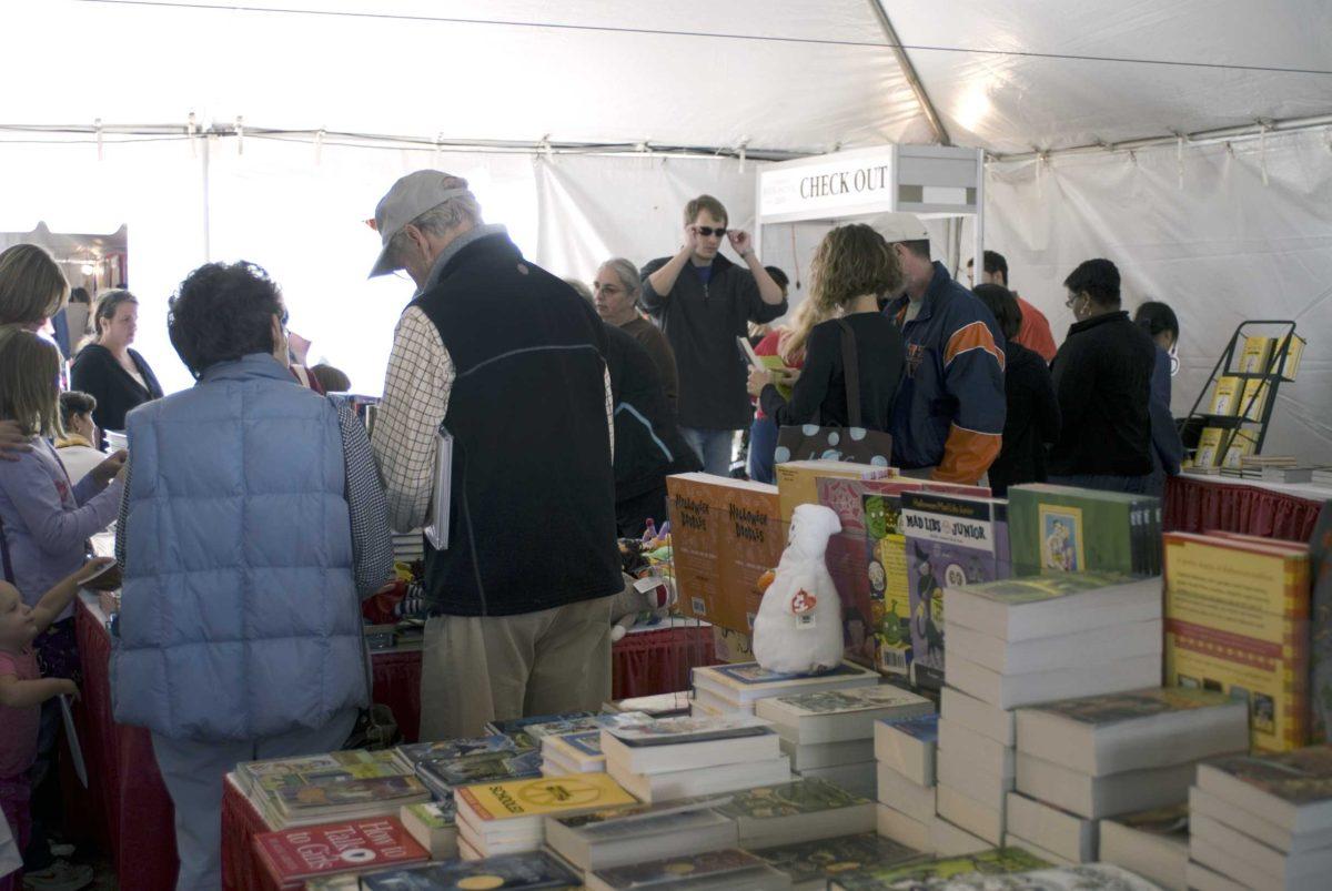 Festival goers check out a tent of children&#8217;s books during the Louisiana Book Festival on Saturday in front of the Louisiana State Capitol building.