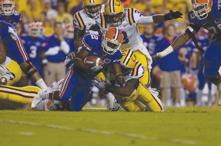 LSU junior linebacker Kelvin Sheppard (11) and junior safety Chad Jones (3) tackle Florida sophomore wide receiver Jeffery Demps (2) in LSU&#8217;s 13-3 loss Saturday.