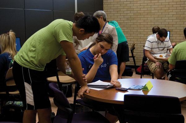 Shane Chang, electrical engineering junior, helps Joanna Thomas, biology freshman, with school work Tuesday in the newly-opened Center for Academic Success tutoring center.