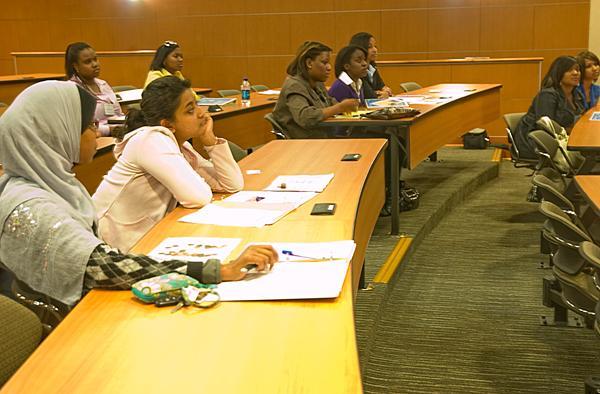 Students listen to Blaine Grimes, financial education coordinator, talk about money matters Saturday as part of the Multicultural Student Leadership Conference.