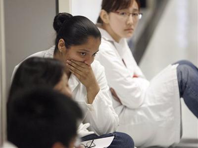 UCLA students wait to be interviewed by police, Thursday, Oct. 8, 2009 in Los Angeles.