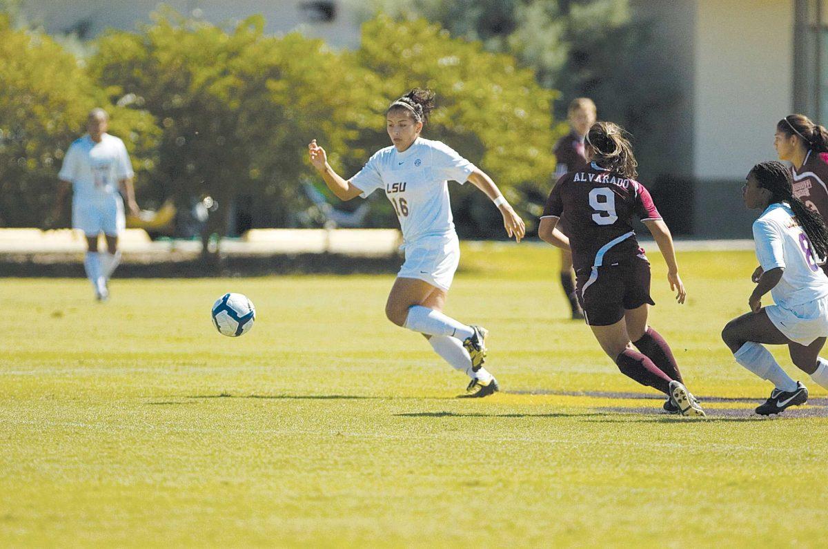 LSU sophomore midfielder Taryne Boudreau chases down a ball in front of Mississippi State freshman midfielder Monica Alvarado and LSU senior midfielder Melissa Clarke on Oct. 18 in the Tigers&#8217; 4-0 win against the Bulldogs.