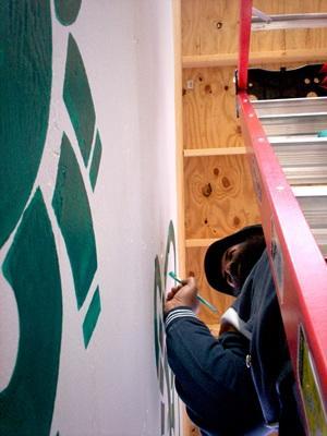 Artist Eric J. Brown works on a mural in a construction walkway at the Shaw Center for the Arts in downtown Baton Rouge in March 2008.