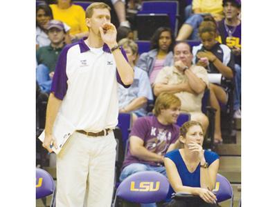 Assistant volleyball coaches Steve Loeswick, left, and Jill Lytle Wilson, right, watch the LSU vs. Nebraska game in the PMAC on Sept. 4. The Tigers lost to the Cornhuskers, 2-3.