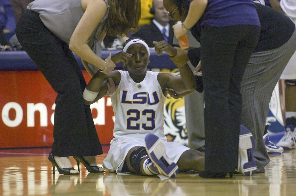 LSU senior guard Allison Hightower is helped off the court Wednesday night after cramping up in the Lady Tigers&#8217; game against Middle Tennessee State in the PMAC.