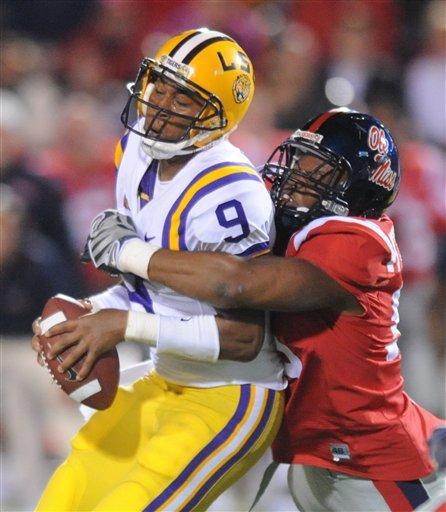 LSU's Jordan Jefferson (9) is sacked by Mississippi's Emmanuel Stephens as time winds down in the fourth quarter during their NCAA college football game on Saturday, Nov. 21, 2009 in Oxford, Miss.