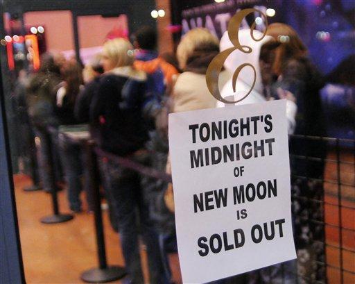 A sold out sign hangs on the Edwards Cinema Theater doors as ticket holders wait in line to be seated for the Midnight showing of New Moon Thursday night November 18, 2009 in Nampa, Idaho.