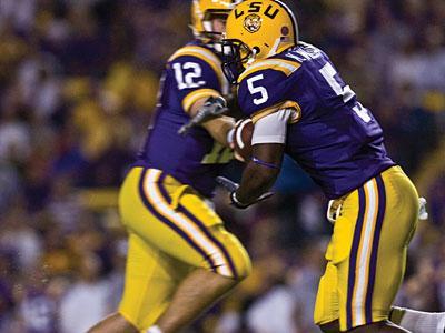 Senior running back Keiland Williams takes a hand off from sophomore quarterback Jarrett Lee on Saturday in the Tigers&#8217; 24-16 win against La. Tech in Tiger Stadium.