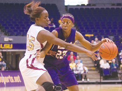 LSU senior guard Allison Hightower defends against a Loyola-New Orleans player Tuesday night.