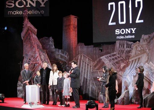 U.S. actor John Cusack, fourth from right, speaks to fans during the Japan premiere of the global-disaster tale 2012 in Tokyo, Japan, Tuesday, Nov. 17, 2009. Looking on him from left are