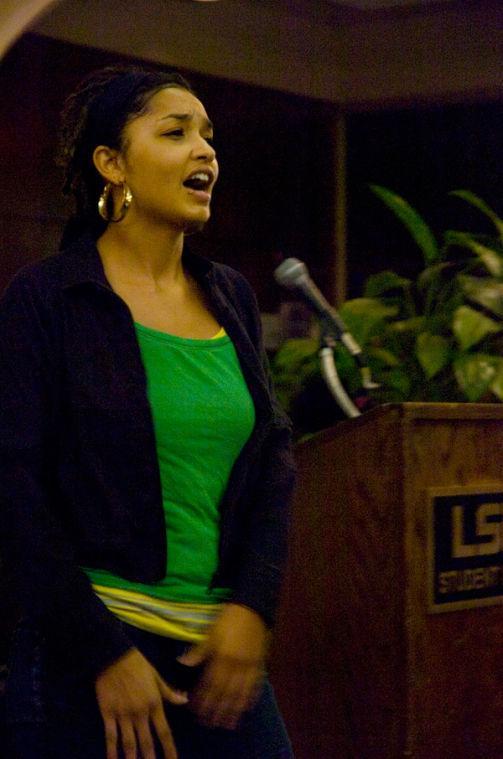 LSU alumna Jasmine Stovall recites a poem at the Sigma Gamma Rho poetry slam Tuesday in the Magnolia Room in the Union.