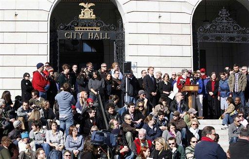 Supporters of same-sex marriage meet on the steps of City Hall, in Portland, Maine, on Wednesday, Nov. 4, 2009, a day after voters rejected the gay marriage law that was passed last May.