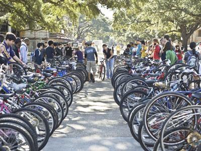 Students stand by lines of bicycles waiting to be auctioned Wednesday afternoon between Coates Hall and Free Speech Alley. The annual event had 144 bikes available.