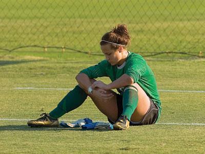 LSU sophomore goal keeper Mo Isom sits on the field Sunday after LSU lost to Texas A&amp;M, 4-2, in a penalty kick shootout.