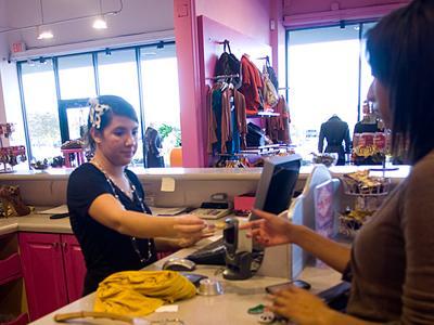 Lauren Jones, communication studies senior, checks out Wednesday afternoon at Frock Candy on Corporate Boulevard.