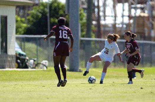 LSU sophomore midfielder Kellie Murphy drives the ball away from Mississippi State sophomore midfielder Kim Pettit on Oct. 18.