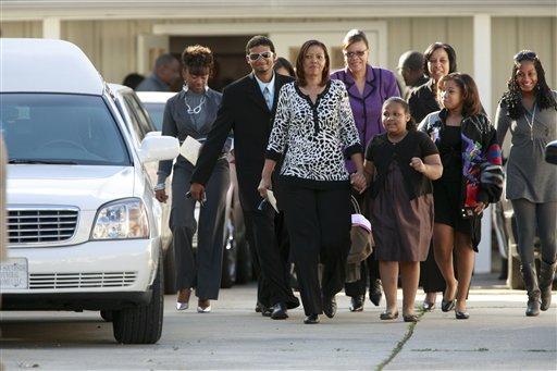 Friends and family of executed D.C. sniper John Allen Muhammad leave the New Southside Funeral Home Tuesday, Nov. 17, 2009 after funeral services for Muhammad in Baton Rouge, La. Muhammad was put to death last week in Virginia for killing Dean Harold Meyers at a gas station during an October 2002 shooting spree.