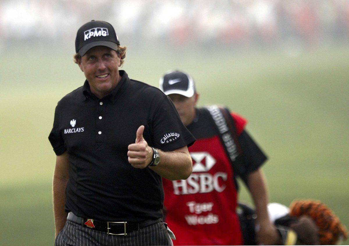 Phil Mickelson flashes his thumb up to spectators at the 18th green during the final round of the HSBC Champions golf tournament in Shanghai on Sunday.