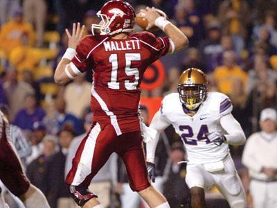 Arkansas sophomore quarterback Ryan Mallett readies himself to throw the ball while LSU linebacker Harry Coleman (24) aims for a sack. &#8220;We started too slow on the offense,&#8221; Mallett said after the game.