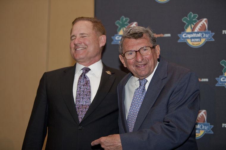 Penn State coach Joe Paterno, right, jokes with LSU coach Les Miles, left, during the Capital One Bowl Kickoff Press Conference in Orlando, Fla., on Dec. 31. The Tigers face the Nittany Lions on Jan. 1 for the Capital One Bowl, the two teams' first meeting since the 1974 Orange Bowl.