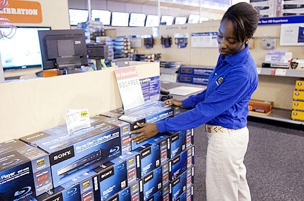 Best Buy employee Anthonise McMorris discusses the advantages of Blu-ray on Tuesday morning at Best Buy on Millerville Road in Baton Rouge.