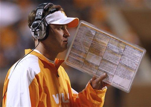 Tennessee head coach Lane Kiffin calls in a play during an NCAA college football game against Vanderbilt, Saturday, Nov. 21, 2009, in Knoxville, Tenn. Tennessee won 31-16.