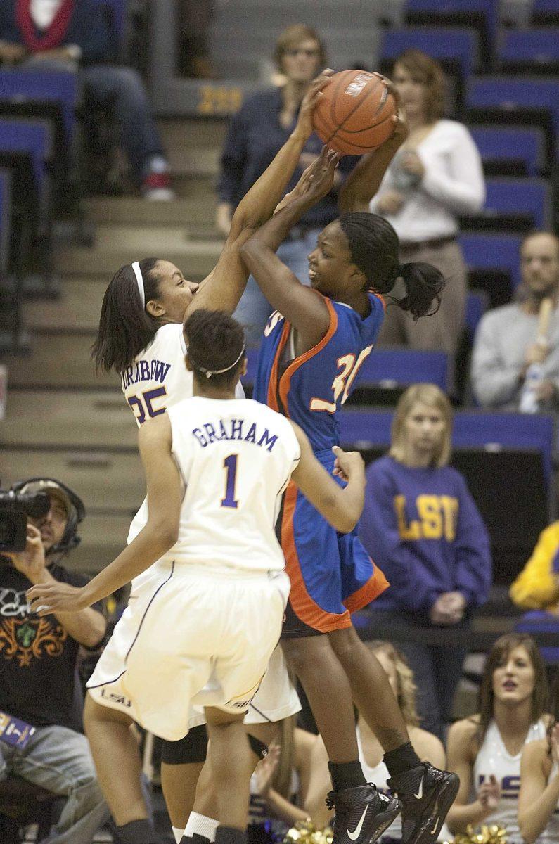 LSU sophomore forward Taylor Turnbow, right, blocks Houston Baptist junior forward Shirolacille Holloway&#8217;s shot Tuesday night during the Lady Tigers&#8217; 93-31 victory against the Lady Huskies at the inaugural Sue Gunter Classic. With the victory, the Lady Tigers will face North Carolina A&amp;T tomorrow night for the championship match.