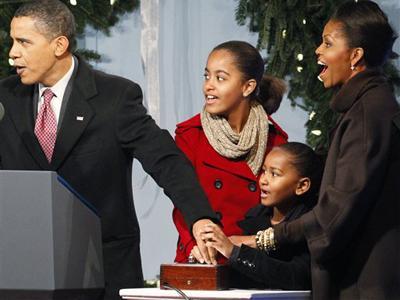 President Barack Obama, first lady Michelle Obama and daughters Sasha and Malia help to light the National Christmas Tree, Thursday, Dec. 3, 2009, in Washington.