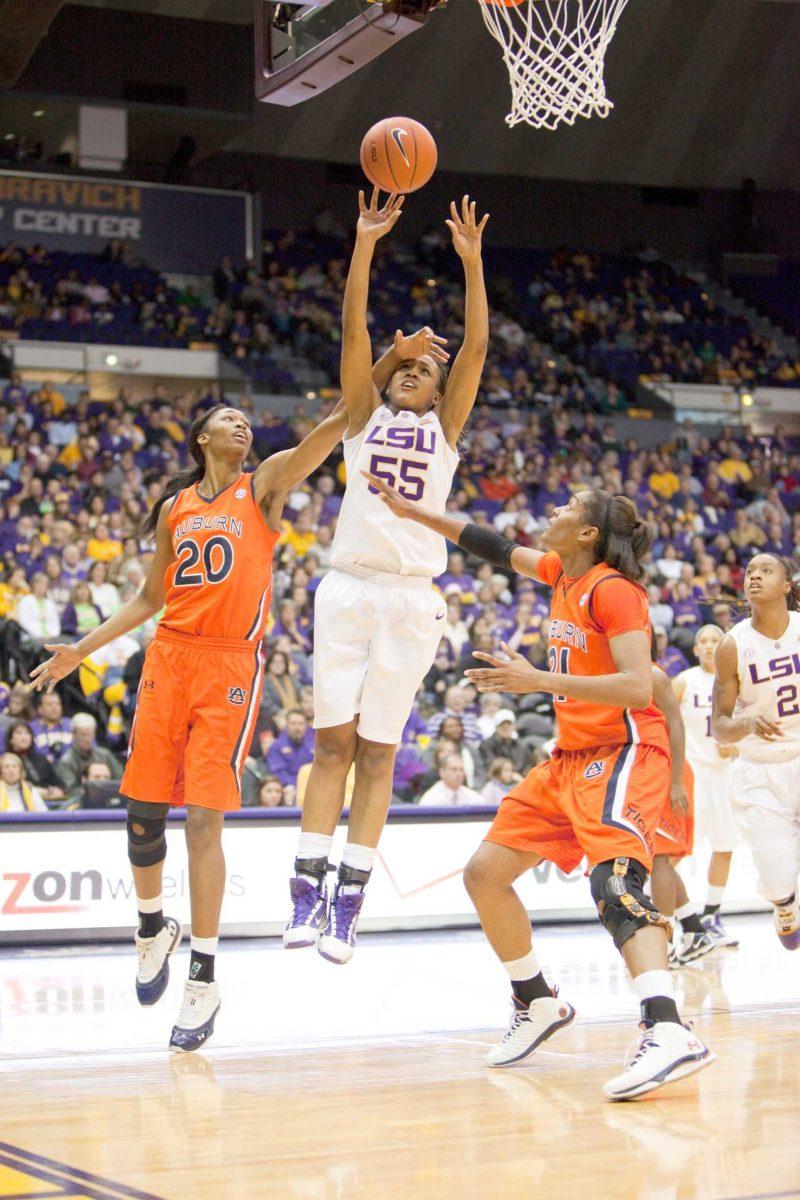 LSU sophomore forward LaSondra Barrett (55) is fouled by Auburn freshman center Pascale West (20) on Jan. 10 during the Tigers&#8217; overtime loss to Auburn in the PMAC.