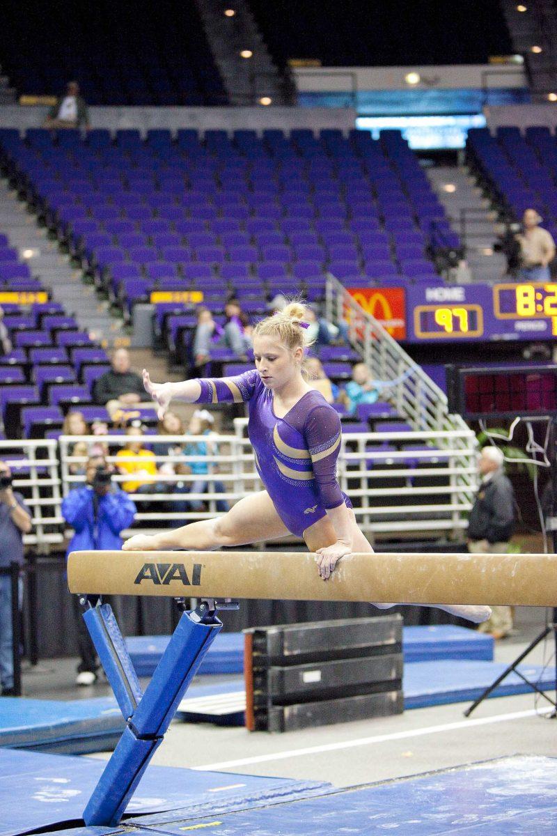 LSU senior Susan Jackson mounts the beam Jan. 8 during the Tigers&#8217; season opener against Maryland in the PMAC. LSU won 194.375-190.625.