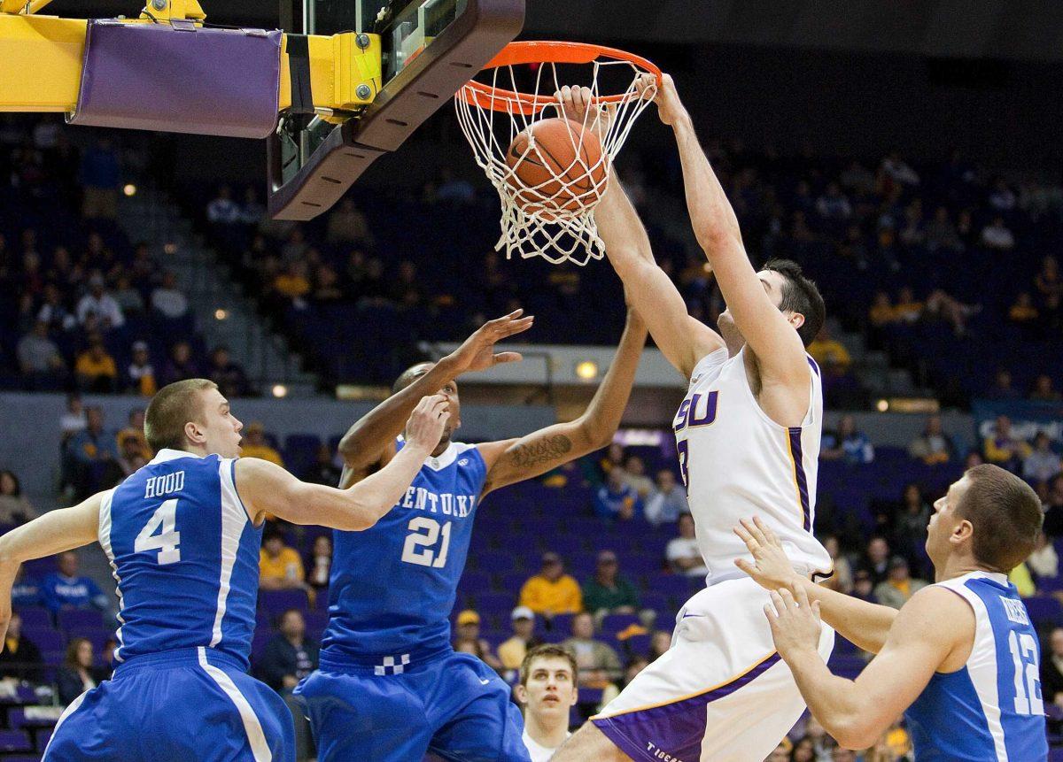 LSU sophomore forward Garrett Green dunks the ball over Kentucky defenders Feb. 6 in the PMAC in the Tigers&#8217; loss.