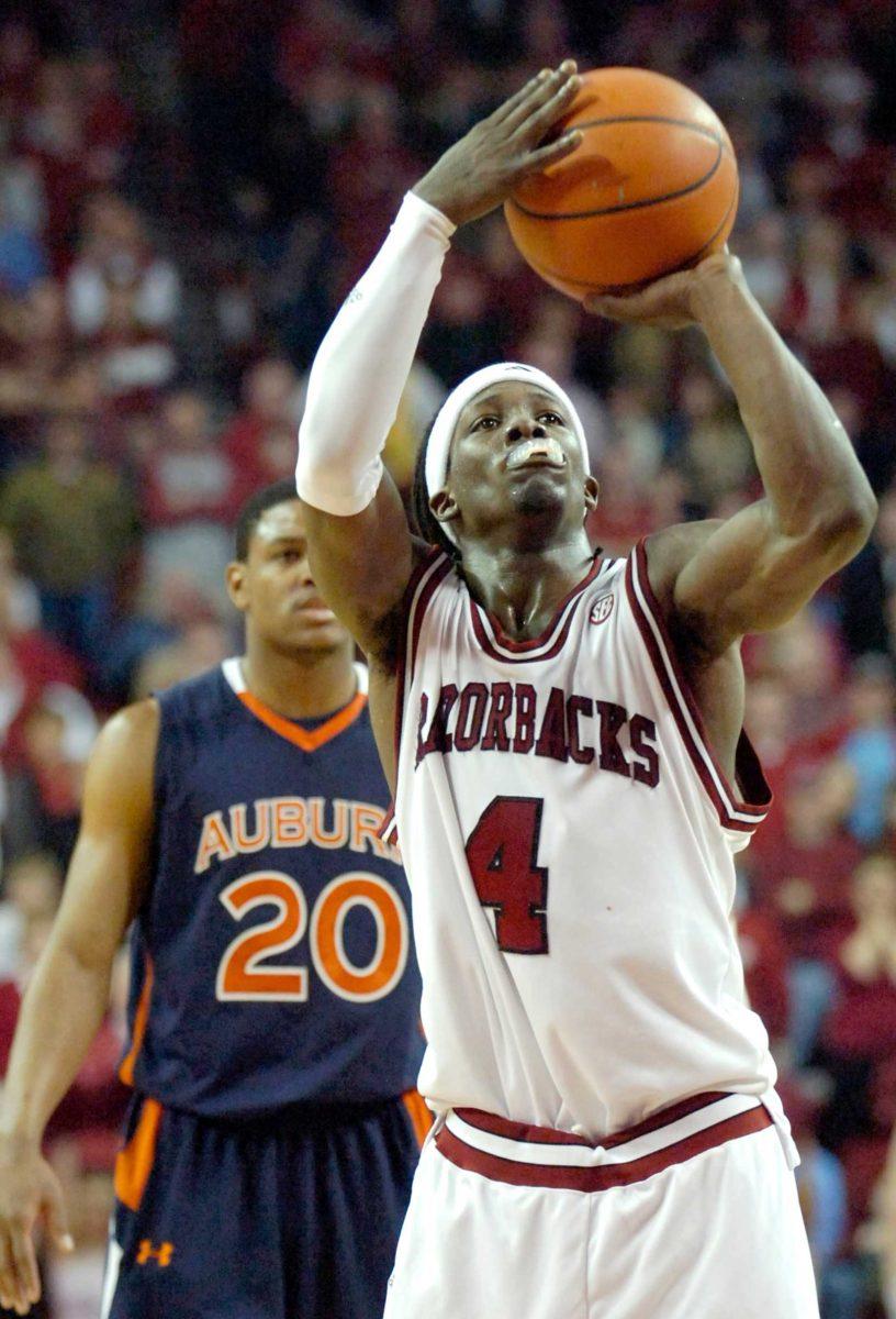 Arkansas&#8217; Courtney Fortson shoots a free throw Feb. 6 as Auburn&#8217;s Frankie Sullivan looks on with four seconds left in overtime. Arkansas defeated Auburn, 82-79.