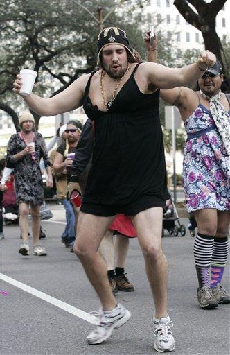 Men in dresses march to celebrate the New Orleans Saints' upcoming Super Bowl appearance in New Orleans, Sunday, Jan. 31, 2010. The parade was held in honor of the late New Orleans sports broadcaster Bernard "Buddy D" Diliberto, who promised his audience that he would wear a dress and parade down Bourbon Street if the Saints ever reached the Super Bowl.