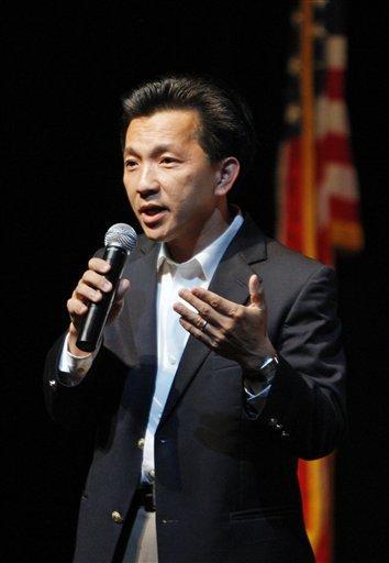 Rep. Anh &#8220;Joseph&#8221; Cao, R-La., answers a question Aug. 18 at a town hall meeting in Westego, La. The lone Republican lawmaker to support Democratic health care legislation has seen his fundraising drop by nearly 40 percent since his vote.