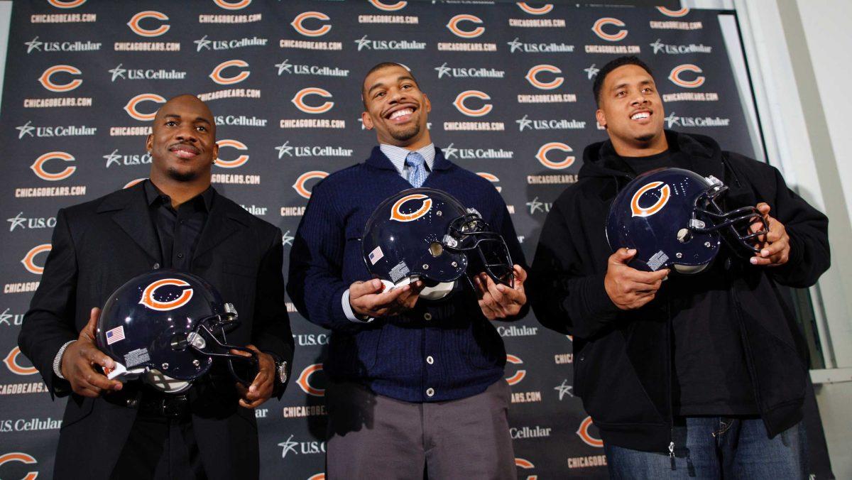 The Chicago Bears introduced recently signed free agents, from left, running back Chester Taylor, defensive end Julius Peppers, and tight end Brandon Manumaleuna during an NFL football news conference at Halas Hall on Friday, March 5, 2010, in Lake Forest, Ill.