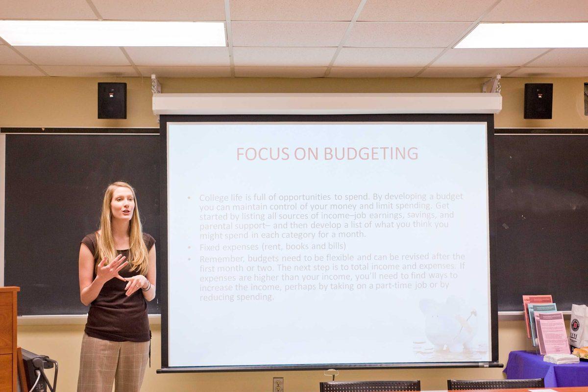 Emily Burris, Student Life coordinator, discusses how to save money living off campus with students Wednesday during &#8220;Don&#8217;t Break the Bank&#8221; in Coates Hall.