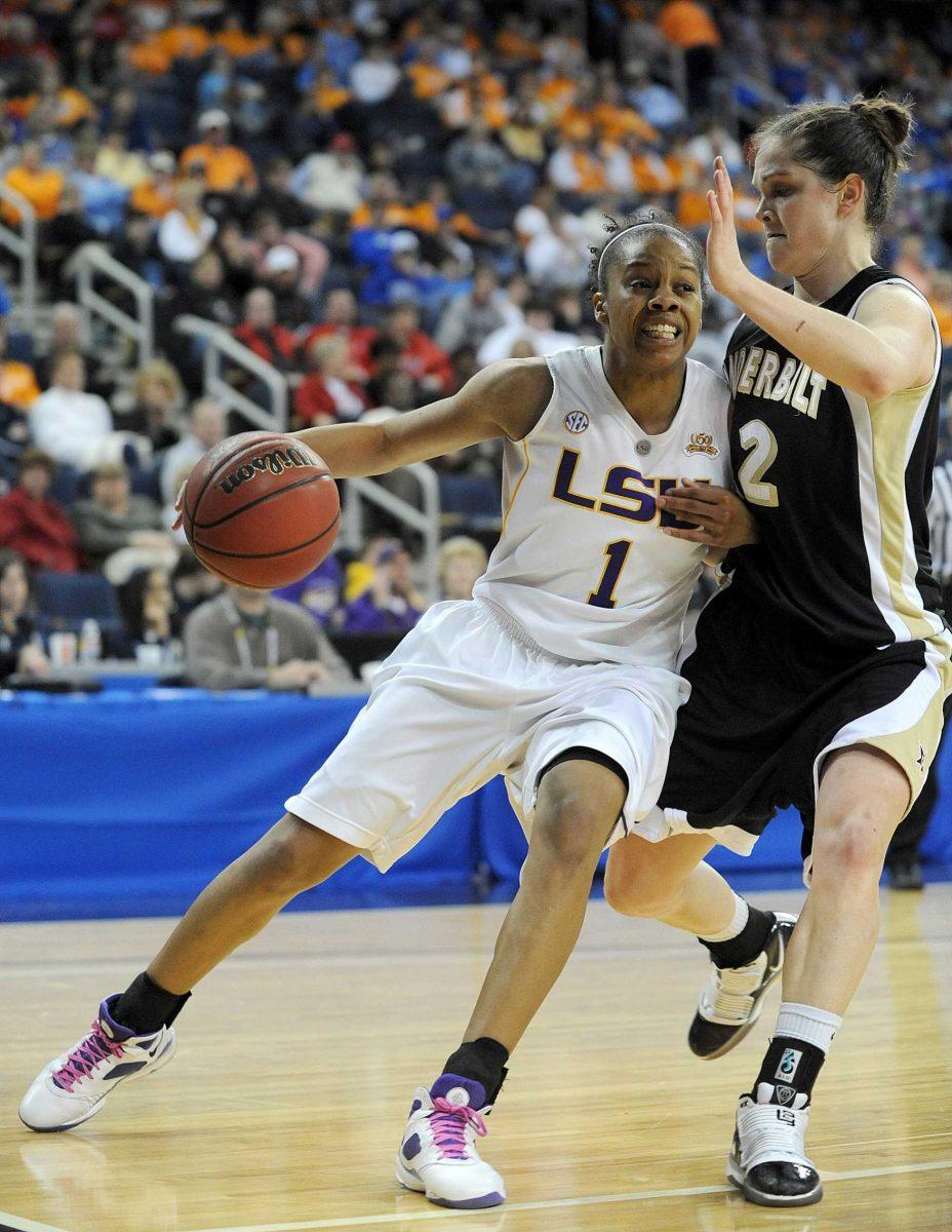 LSU guard Katherine Graham (1) tries to get past Vanderbilt guard Jence Rhoads (22) Friday during a second-round game of the SEC tournament. LSU lost, 63-61.