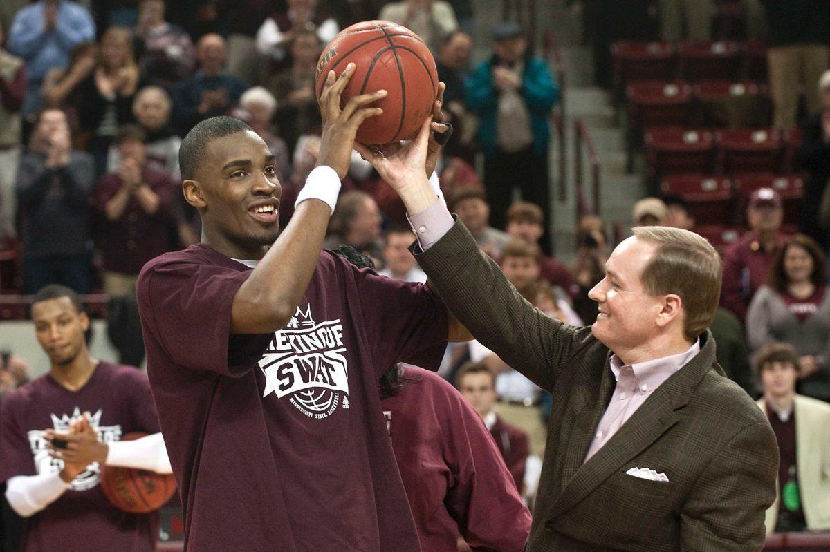 Mississippi State president Mark E. Keenum, right, presents forward Jarvis Varnado with a game ball Wednesday at Humphrey Coliseum.