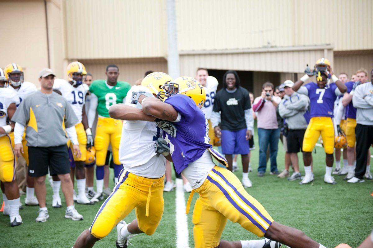 LSU sophomore wide receiver Russell Shepard, left, takes on junior center back Brandon Taylor, right, March 16 in the Big Cat Drill.