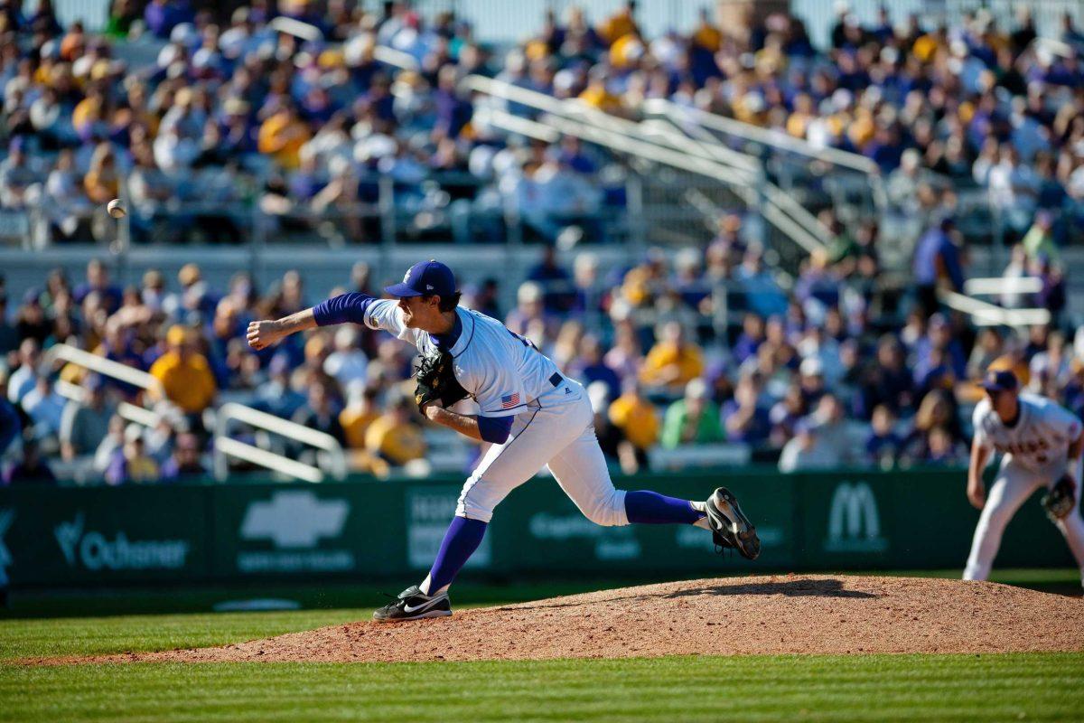 LSU junior pitcher Austin Ross (12) pitches the ball March 13 in Alex Box Stadium during the Tigers&#8217; game against Kansas. LSU beat Kansas, 4-2.