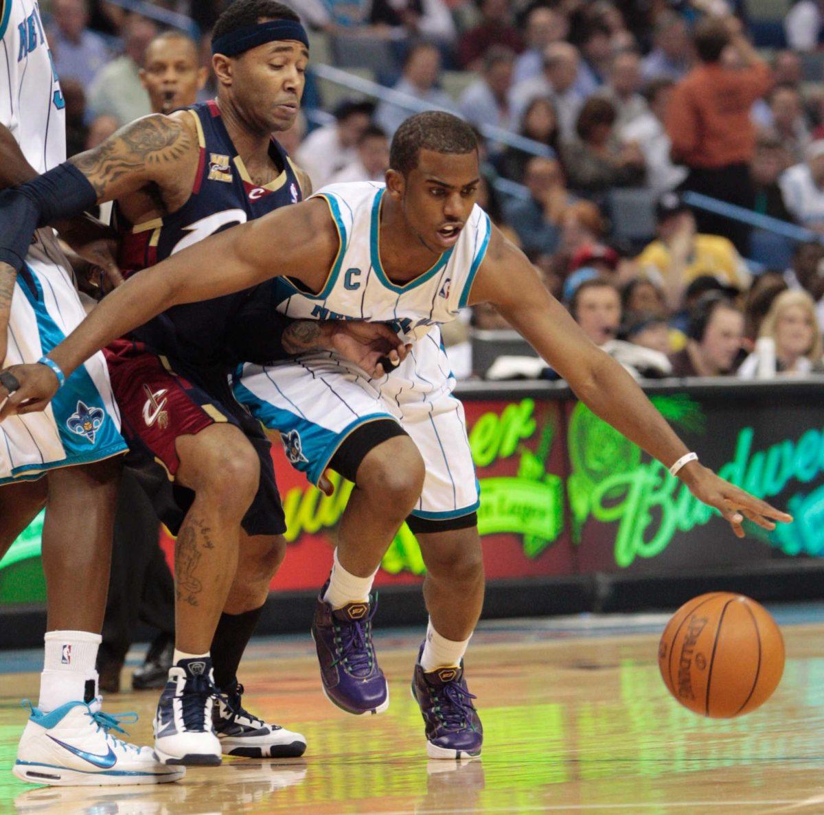 New Orleans Hornets guard Chris Paul (3) pushes past Cleveland Cavaliers guard Mo Williams in New Orleans on Wednesday in the Hornets&#8217; loss.