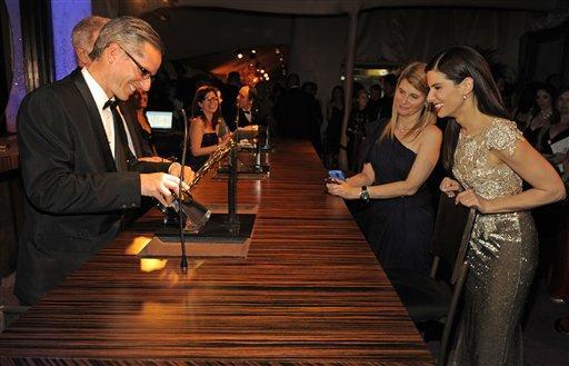 Sandra Bullock has her Oscar for Best Acress engraved at the Governors Ball following the the 82nd Academy Awards Sunday, March 7, 2010, in the Hollywood section of Los Angeles.