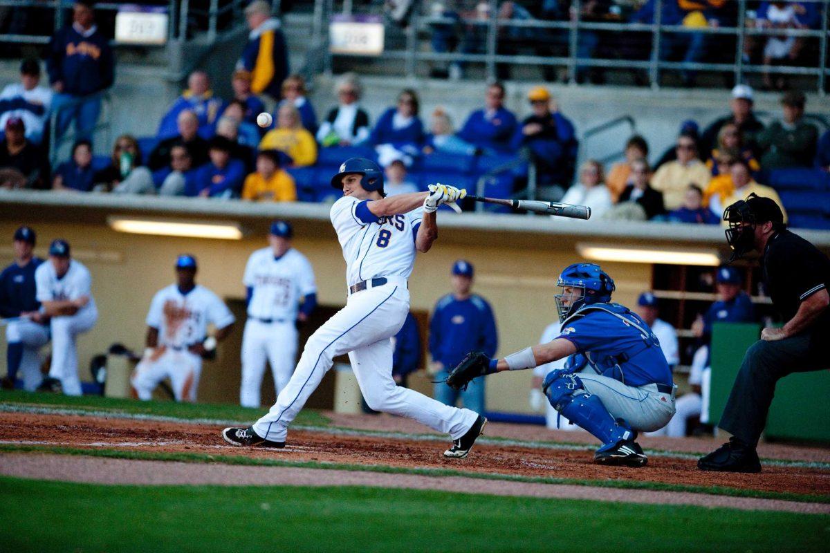 LSU sophomore outfielder Mikie Mahtook (8) swings for the ball Saturday during the Tigers&#8217; 4-2 win against Kansas in Alex Box Stadium.