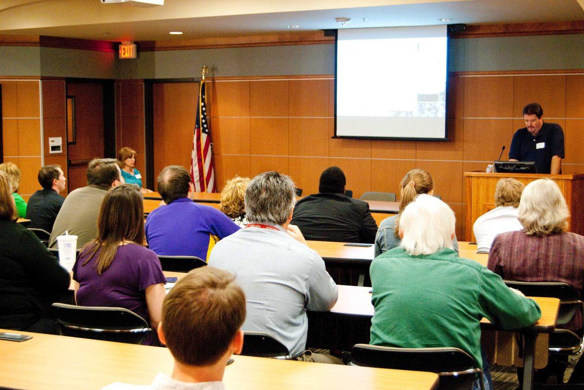 Tim David, Apple system engineer, discusses how universities can create apps for iPhones, BlackBerries and other phones Tuesday in the Capitol Chamber in the Union.